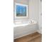 Relaxing bathroom with soaking tub and large window at 172 Austin Dr, Mcdonough, GA 30252