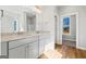 Double vanity bathroom with granite countertop and large mirror at 172 Austin Dr, Mcdonough, GA 30252