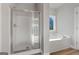 Bathroom with shower and garden tub, offering lots of natural light at 172 Austin Dr, Mcdonough, GA 30252