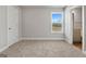 Cozy bedroom with carpet and large window at 172 Austin Dr, Mcdonough, GA 30252