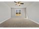 Bright bedroom featuring a large window and ceiling fan at 172 Austin Dr, Mcdonough, GA 30252