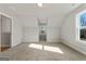 Bright bedroom with vaulted ceilings, carpeting, and two windows offering natural light at 172 Austin Dr, Mcdonough, GA 30252