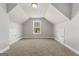 Large bonus room with sloped ceilings and carpet at 172 Austin Dr, Mcdonough, GA 30252