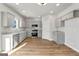 Modern kitchen with gray cabinets, stainless steel appliances and granite countertops at 172 Austin Dr, Mcdonough, GA 30252