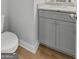 Small powder room with gray vanity and granite countertop at 172 Austin Dr, Mcdonough, GA 30252