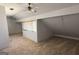 Finished attic with unique architectural details, carpet, and bright window seating area at 97 Willowick Dr, Lithonia, GA 30038