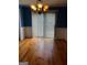 Dining room with hardwood floors and a bright chandelier at 97 Willowick Dr, Lithonia, GA 30038