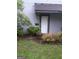 Inviting front entrance with landscaping and a large potted plant at 97 Willowick Dr, Lithonia, GA 30038