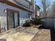 A cozy patio area with a sliding glass door leading indoors at 97 Willowick Dr, Lithonia, GA 30038
