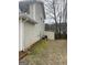Backyard with AC unit, moss, and an open grassy space at 1611 Cobbs Creek Ln, Decatur, GA 30032
