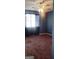 Bedroom with a window, neutral carpet, ceiling fan and light fixture at 1611 Cobbs Creek Ln, Decatur, GA 30032