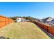 Expansive backyard with a view of the home and neighborhood at 112 Twelve Parks Trail, Sharpsburg, GA 30277