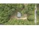 Aerial view of a house nestled in a wooded area at 184 Elm St, Covington, GA 30014