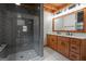 Modern bathroom with double vanity, large shower, and stylish tile at 184 Elm St, Covington, GA 30014