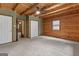 Spacious bedroom with wood walls and ceiling, and ample closet space at 184 Elm St, Covington, GA 30014