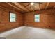Bedroom with wood walls and ceiling fan at 184 Elm St, Covington, GA 30014