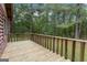 Wooden deck overlooking a wooded backyard at 184 Elm St, Covington, GA 30014