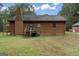 Back of log cabin home with deck and access to backyard at 184 Elm St, Covington, GA 30014
