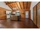 Open kitchen with island, dark wood cabinets and flooring at 184 Elm St, Covington, GA 30014