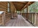 Relaxing front porch with wooden rocking chairs and wooded views at 184 Elm St, Covington, GA 30014