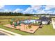 Aerial view of community pool, playground, and clubhouse at 157 Aster Ave, Locust Grove, GA 30248