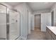 Bathroom with shower, vanity, and linen closet at 157 Aster Ave, Locust Grove, GA 30248