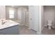 Modern bathroom with double vanity and walk-in shower at 157 Aster Ave, Locust Grove, GA 30248