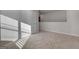 Upstairs bedroom with carpet and natural light at 157 Aster Ave, Locust Grove, GA 30248
