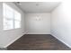 Simple dining room with hardwood floors and chandelier at 157 Aster Ave, Locust Grove, GA 30248