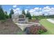 Community entrance sign with a stone water feature at 157 Aster Ave, Locust Grove, GA 30248