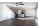 Open kitchen with island and modern appliances, hardwood floor at 157 Aster Ave, Locust Grove, GA 30248