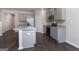Modern kitchen with gray cabinets and granite countertops at 157 Aster Ave, Locust Grove, GA 30248
