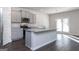 Modern kitchen with island and stainless steel appliances at 157 Aster Ave, Locust Grove, GA 30248