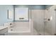 Bathroom with soaking tub and walk in shower at 603 Parnassus Rd, Locust Grove, GA 30248