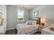 Cozy bedroom with a comfortable bed, nightstand and ample natural light at 603 Parnassus Rd, Locust Grove, GA 30248