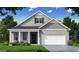 Two-story craftsman style home with gray siding and brick accents at 603 Parnassus Rd, Locust Grove, GA 30248