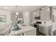 Bright kitchen with gray cabinets and a large kitchen island at 603 Parnassus Rd, Locust Grove, GA 30248