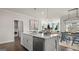 Open concept kitchen with island and stainless steel appliances at 603 Parnassus Rd, Locust Grove, GA 30248
