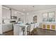 Modern kitchen with white island and gray cabinets at 603 Parnassus Rd, Locust Grove, GA 30248
