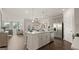 Spacious kitchen with island, stainless steel appliances, and hardwood floors at 603 Parnassus Rd, Locust Grove, GA 30248