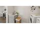 Convenient laundry room complete with washer, dryer, and extra storage at 603 Parnassus Rd, Locust Grove, GA 30248