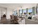 Bright and airy living room with large windows and hardwood floors at 603 Parnassus Rd, Locust Grove, GA 30248