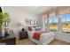 The bedroom has three large windows that bring in plenty of natural light and a view of the outdoors at 592 Parnassus Rd, Locust Grove, GA 30248