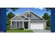 Charming one-story home featuring gray brick, white trim, and a two-car garage at 592 Parnassus Rd, Locust Grove, GA 30248