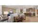 Open-concept living room and kitchen with stainless steel appliances, granite countertops, and bar seating at 592 Parnassus Rd, Locust Grove, GA 30248