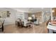 Open living space with dining area, kitchen, living room furniture and hardwood flooring at 592 Parnassus Rd, Locust Grove, GA 30248
