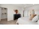 Bright bedroom with a walk-in closet and a stylish dresser featuring sleek, modern designs and an ensuite bathroom at 592 Parnassus Rd, Locust Grove, GA 30248