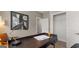 Close-up on a home office desk with a modern lamp, open notebook, and closet in the background at 592 Parnassus Rd, Locust Grove, GA 30248