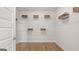 Spacious walk-in closet with wire shelving and wood floors offers ample storage space at 592 Parnassus Rd, Locust Grove, GA 30248