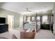 Main bedroom with four-poster bed and soft green walls at 415 Burbury Close, Fayetteville, GA 30215